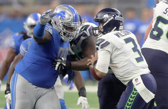 Detroit Lions defensive tackle Damon Harrison Sr. sacks Seattle Seahawks quarterback Russell Wilson during the fourth quarter Sunday, October 28, 2018 at Ford Field in Detroit.