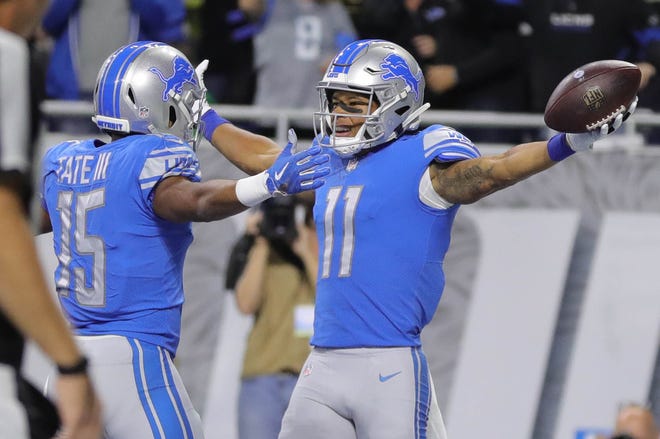Detroit Lions receivers Marvin Jones Jr. (11) and Golden Tate celebrate Jones' touchdown during the first half against the Seattle Seahawks on Sunday, October 28, 2018 at Ford Field in Detroit.
