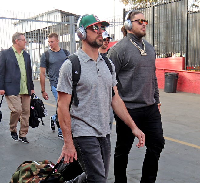 Green Bay Packers quarterback Aaron Rodgers (12) and offensive tackle David Bakhtiari (69) arrive for the game against the LA Rams Sunday, October 28, 2018 at the Memorial Coliseum in Los Angeles.