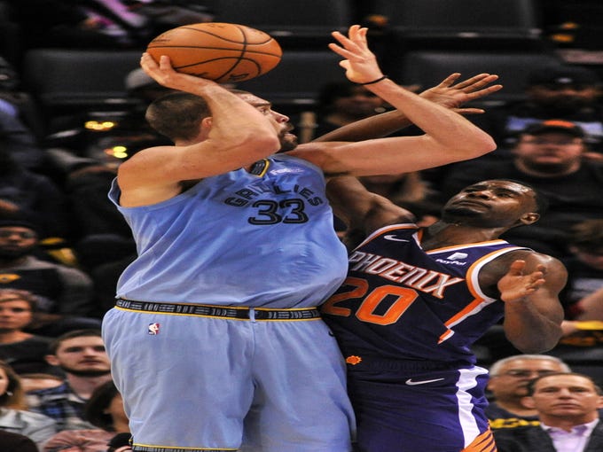Oct 27, 2018; Memphis, TN, USA; Memphis Grizzlies center Marc Gasol (33) shoots the ball as Phoenix Suns forward Josh Jackson (20) defends during the first half at FedExForum. Mandatory Credit: Justin Ford-USA TODAY Sports