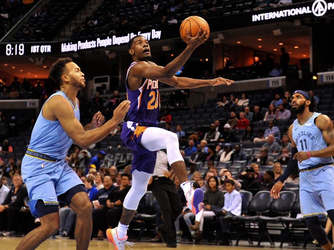 Oct 27, 2018; Memphis, TN, USA; Phoenix Suns forward Josh Jackson (20) goes to the basket against Memphis Grizzlies forward Kyle Anderson (1) and Memphis Grizzlies guard Mike Conley (11) during the first half at FedExForum. Mandatory Credit: Justin Ford-USA TODAY Sports