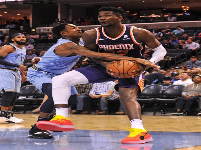 Oct 27, 2018; Memphis, TN, USA; Memphis Grizzlies guard MarShon Brooks (8) guards Phoenix Suns center Deandre Ayton (22) during the first half at FedExForum. Mandatory Credit: Justin Ford-USA TODAY Sports