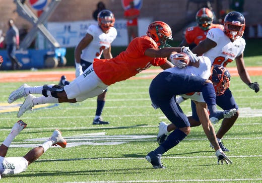 FAMU linebacker Elijah Richardson dives for a tackle on Morgan State wide receiver Manasseh Bailey.