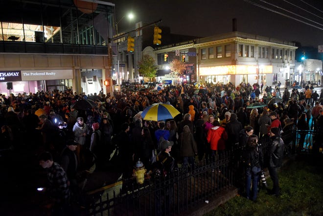 Mourners gather in the Squirrel Hill neighborhood of Pittsburgh for a vigil. 