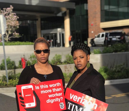 Tasha Murrell, right, stands outside a Verizon shareholders meeting in Renton, Wash., in May 2018. Murrell worked at XPO Logistics in Memphis, which distributes retail products for Verizon and Disney worldwide. While at XPO, she requested a reprieve from lifting heavy boxes while pregnant in 2014. Murrell miscarried after, she says, that request was denied.