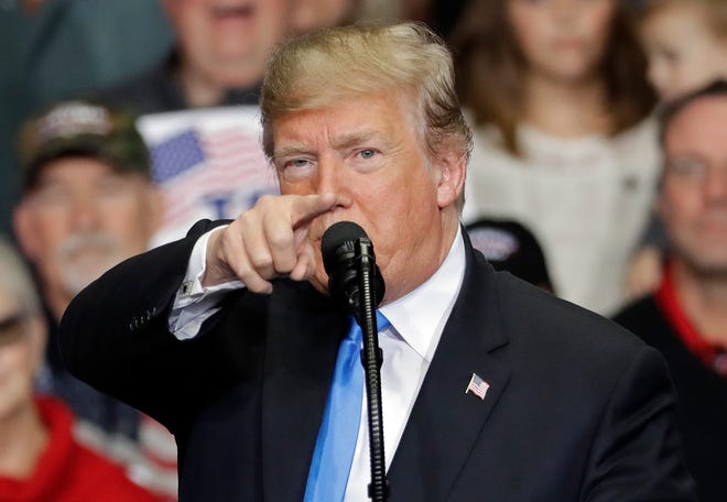In this Oct. 26, 2018, photo, President Donald Trump points to the media as he speaks during a campaign rally in Charlotte, North Carolina.