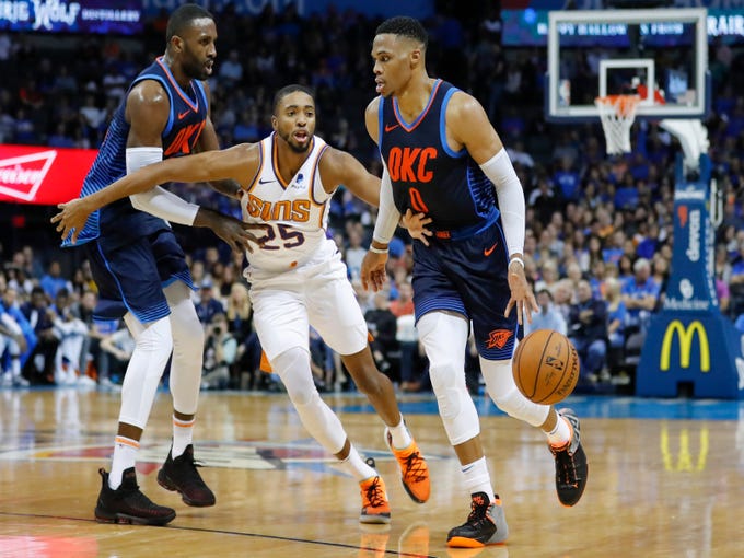 Oct 28, 2018; Oklahoma City, OK, USA; Oklahoma City Thunder guard Russell Westbrook (0) drives to the basket as Phoenix Suns forward Mikal Bridges (25) defends during the second half at Chesapeake Energy Arena. Oklahoma City won 117-110. Mandatory Credit: Alonzo Adams-USA TODAY Sports