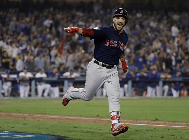Boston Red Sox's Steve Pearce celebrates his second home run during the eighth inning in Game 5 of the World Series baseball game against the Los Angeles Dodgers on Sunday, Oct. 28, 2018, in Los Angeles. (AP Photo/David J. Phillip)