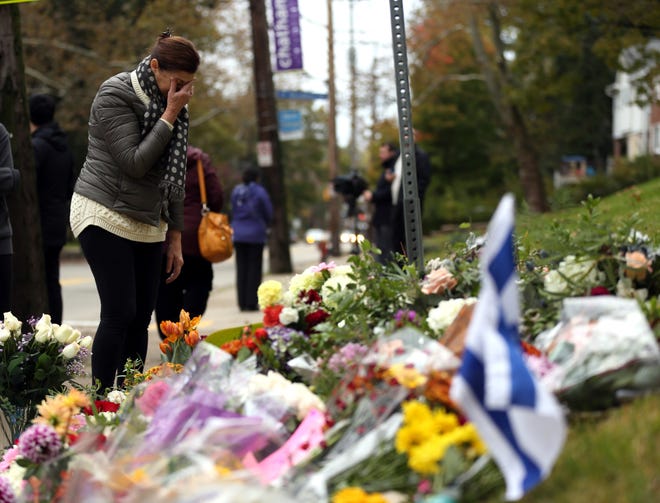 A person mourns at a makeshift memorial at the Tree of Life Congregation synagogue in Pittsburgh.