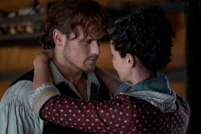 Jamie (Sam Heughan) and Claire (Caitriona Balfe) share a meaningful embrace in Starz's fourth season of 'Outlander.'