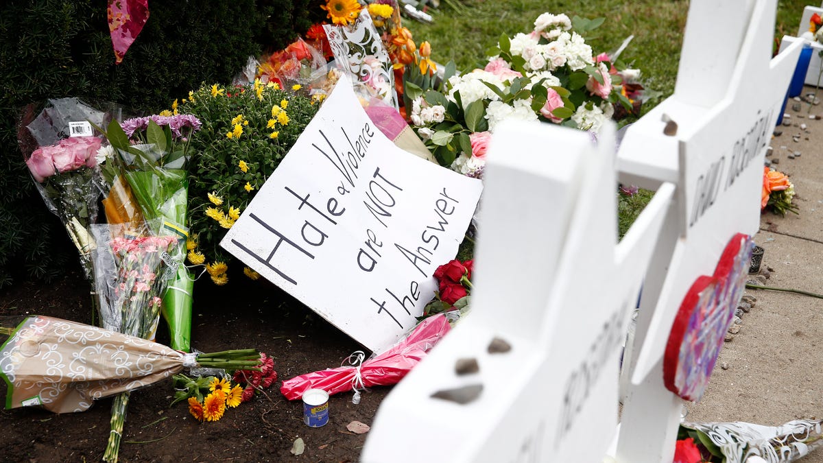 Flowers, candles, and letters are left at the Star of David memorials with the names of the 11 people who were killed at the Tree of Life synagogue two days after a mass shooting in Pittsburgh, Pennsylvania.