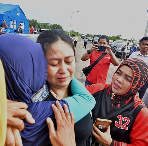 Putri is consoled for the loss of her husband and...