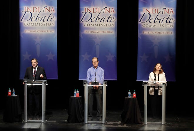 Democratic Sen. Joe Donnelly, Republican former state Rep. Mike Braun and Libertarian Lucy Brenton, from left, participate in a U.S. Senate Debate, Tuesday, Oct. 30, 2018, in Indianapolis.