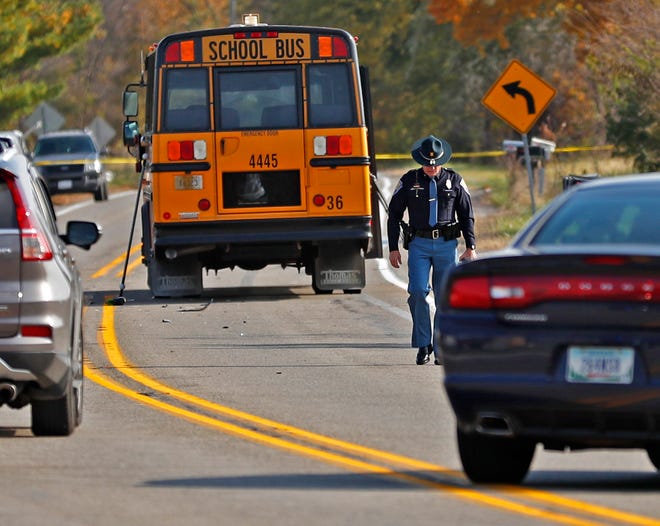 The scene is investigated on State Rd. 25 in Rochester, IN, where a pickup truck hit and killed three young children and critically injured a fourth as the children crossed the street to get on this school bus, Tuesday, Oct. 30, 2018.  The bus was stopped with lights and stop indicators in use.