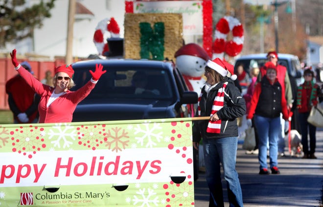 A float and marchers from Columbia St. Mary's move along Main Street during the 2014 Germantown Christmas Parade. This year's celebration starts at 1:30 p.m. Saturday, Nov. 10.