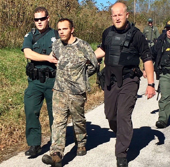 Jacob Stanley Snyder, 29, center, has been charged with one count of First Degree Murder and two counts of Attempted First Degree Murder in connection with a Monday morning shooting in Clay County, the Tennessee Bureau of Investigation said.
