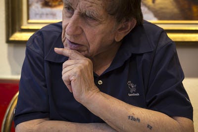 Bernard Scheer talks about how he survived the Holocaust at his home in Westminster Village in Scottsdale.