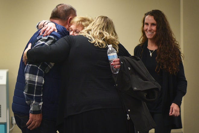 Lynette Johnson hugs Derrick Schafer and Cindy Schmit while walking into the press conference with her daughter Toni Schafter after Rodney Berget is executed Monday, Oct. 29, at the South Dakota State Penitentiary in Sioux Falls.
