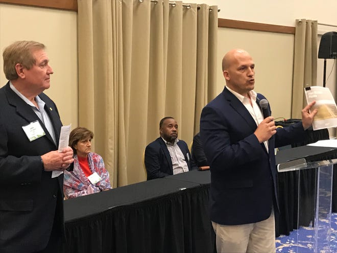Port St. Lucie Mayor Oravec addresses an audience of real estate and development professionals Oct. 29, 2018 during a welcome reception for a team of planners assembled by the Urban Land Institute. John Walsh (left), of TIG Real Estate Services, is the chair of the panel.