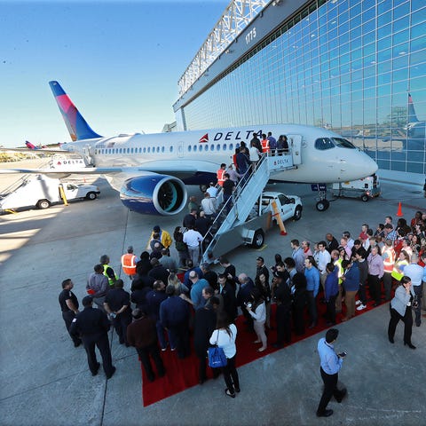 Delta employees and guests tour the new A220...