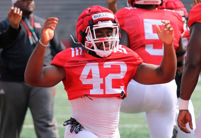 In this Aug. 16, 2018 photo, Rutgers linebacker Izaia Bullock works at training camp in Piscataway, N.J. Prosecutors in New Jersey said Bullock was charged in connection with an alleged plot to commit murder.