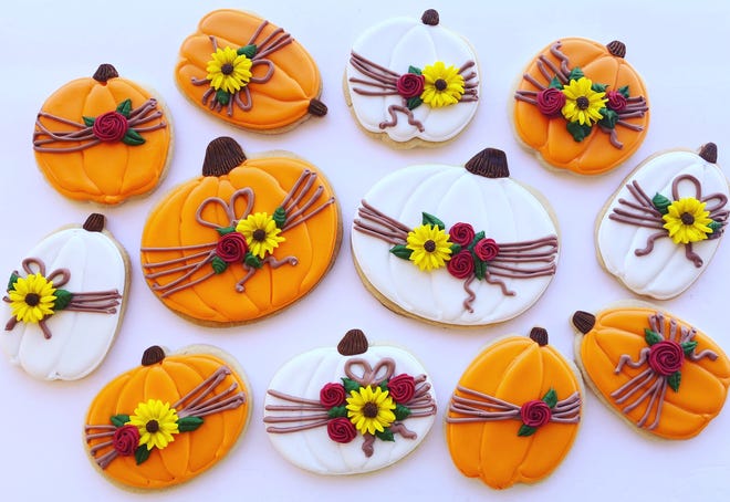 Pumpkin cookies with a floral design created by Maricopa baker Julia Perugini.