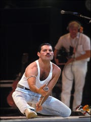 Freddie Mercury sings at Live Aid in 1985.