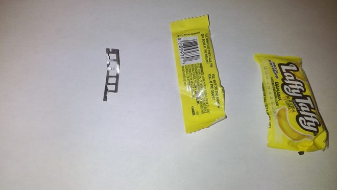 Middlebury police say this piece of metal was found in a Laffy Taffy candy given to a child for Halloween. Police believe the metal became embedded in the candy during the manufacturing process and that the candy was not tampered with.