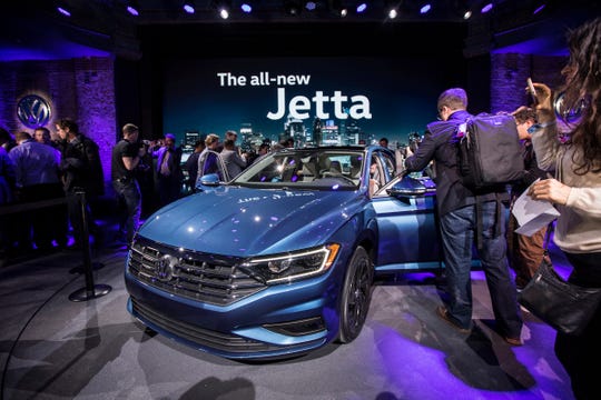 Guests check out a 2019 Volkswagen Jetta at the Garden Theater in Detroit on Sunday, Jan. 14, 2018.