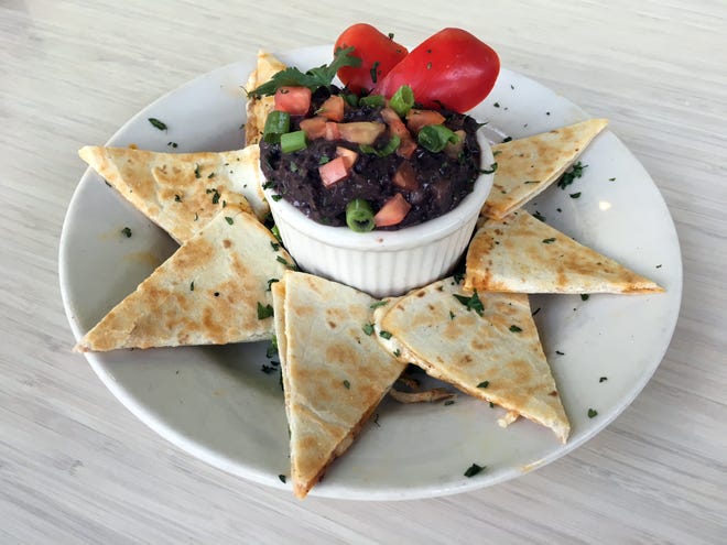 Beans & Barley's black bean dip starts with dried beans and is served with cheese quesadillas.
