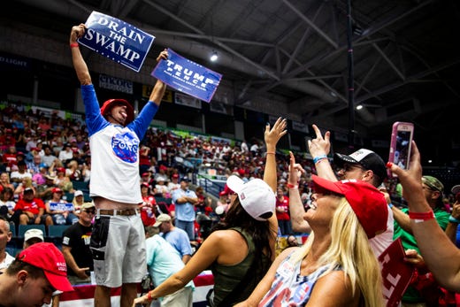 Justin Parker of Marco Island dances to "We are the Champions" before a Trump rally on Wednesday, October 31, 2018, at Hertz Arena in Estero.