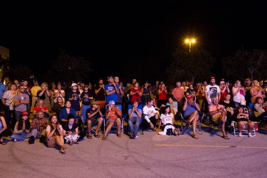 Remaining supporters who were unable to make it inside the arena stand outside and listen to President Trump's speech at the Trump rally on Wednesday, October 31, 2018, at Hertz Arena in Estero.