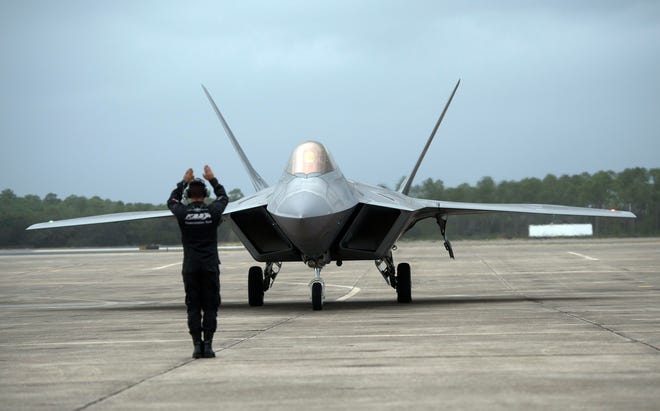 One of two Air Force F-22 Raptors arrives at Pensacola Naval Air Station on Thursday, Nov. 1, 2018. The high tech jets based out of Langley Air Force Base were in town to take part in a Blue Angel Homecoming Air Show.