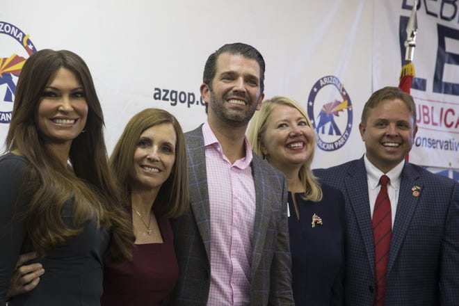 Donald Trump Jr. (center) is photographed Nov. 1, 2018, with his girlfriend, Kimberly Guilfoyle (left), Senate candidate and U.S. Rep. and Martha McSally, R-Ariz., (second from left), and U.S. Rep. Debbie Lesko, R-Ariz., (second from right) and Arizona GOP Chairman Jonathan Lines (right) on at a Get Out The Vote rally at the Arizona GOP's West Valley office at 10050 W. Bell Road.