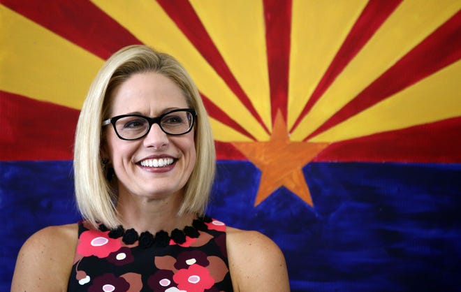 Kyrsten Sinema, the Democratic candidate for the U.S. Senate appears at get-out-the-vote event with members of the Veterans for Sinema coalition and volunteers on Nov. 1 in Phoenix.