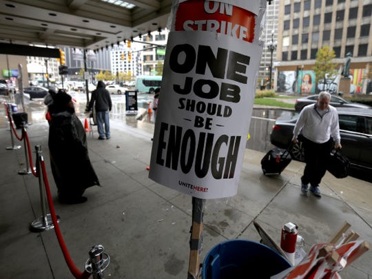 More than 130 union workers in Detroit have been on strike at the Westin Book Cadillac since last month. In the rain, on Thursday, November 1, 2018, a handful of them scroll past the main entrance to the sound of a drum that beats.