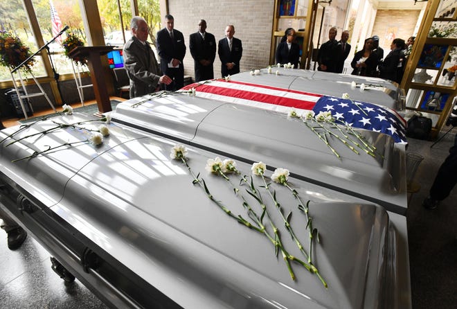 About 300 unclaimed remains that were removed from Cantrell Funeral Home after the facility was closed in April were honored Friday during a service at Mt. Olivet Cemetery in Detroit.
