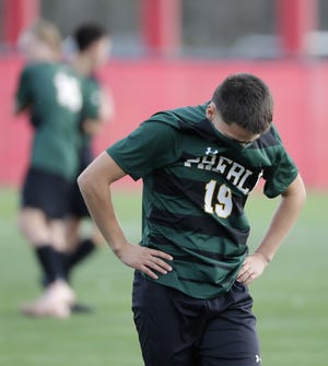 Green Bay Preble's Gonzalo Huete (19) hangs his head after a 3-0 loss against Hamilton in a WIAA Division 1 boys soccer state semifinal Friday at Uihlein Soccer Park in Milwaukee.