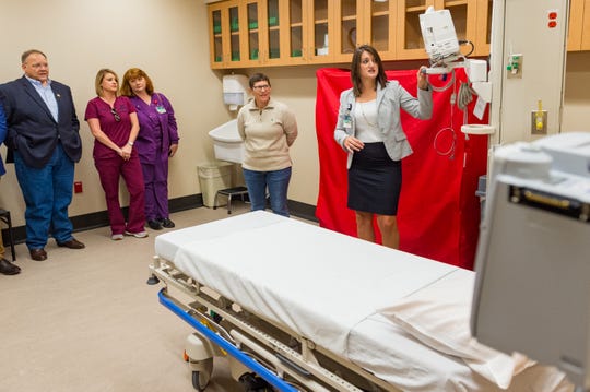 Radiology Manager Lessie Doucet explains new equipment to guest as Acadia General Hospital cuts ribbon on new Emergency Department. Friday, Nov. 2, 2018.