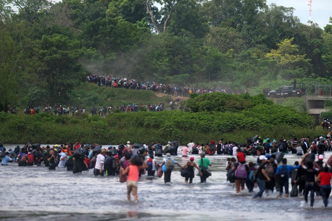 Salvadorian migrants heading in a caravan to the US, cross the Suchiate River to Mexico, as seen from Ciudad Tecun Uman, Guatemala, on Nov. 02, 2018. According to the Salvadorian General Migration Directorate, over 1,700 Salvadorians left the country in two caravans and entered Guatemala Wednesday, in an attempt to reach the US.