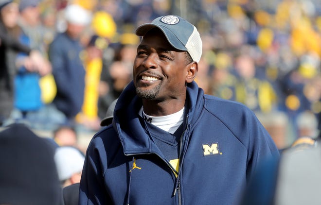 Former Michigan basketball player Chris Webber walks on the football field before the start of the Michigan and Penn State game on Saturday, Nov. 3,2018, at Michigan Stadium.