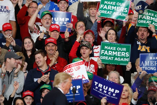 The crowd cheers as United States President Donald Trump campaigns for Republican candidate Mike Braun during a rally at Southport Fieldhouse on Friday, Nov. 2, 2018.
