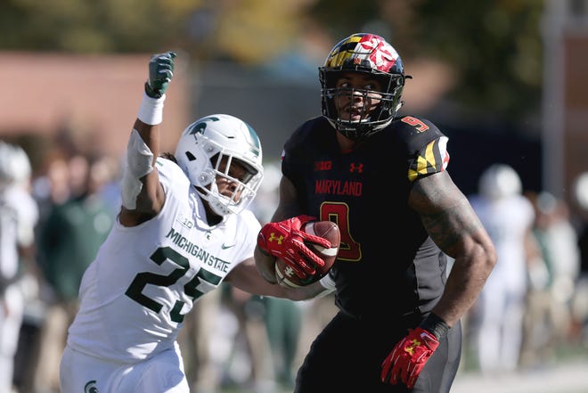 Darrell Stewart Jr. #25 of the Michigan State Spartans forces a fumble on Byron Cowart #9 of the Maryland Terrapins during the second half at Capital One Field on November 3, 2018 in College Park, Maryland.