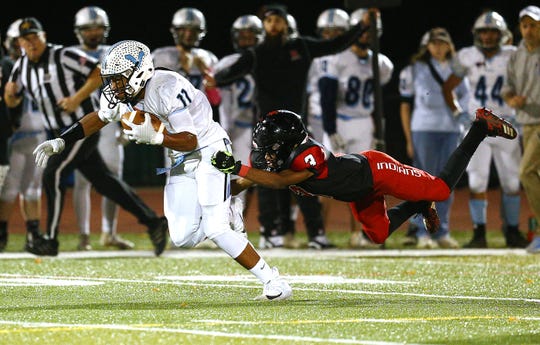 Parsippany Hills Jordan Thompson gains yardage taking Rahway's Rashon Bradford with him during their NJSIAA North 2 Group III football quarterfinal at Rahway River Park. November 2, 2018, Rahway, NJ