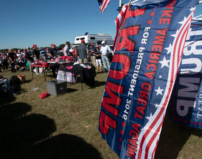 Supporters of Donald Trump gather Saturday, Nov. 3, 2018, outside the Pensacola International Airport ahead of the president rally.