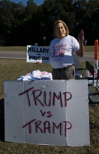 Supporters of Donald Trump gather Saturday, Nov. 3, 2018, outside the Pensacola International Airport ahead of the president rally.