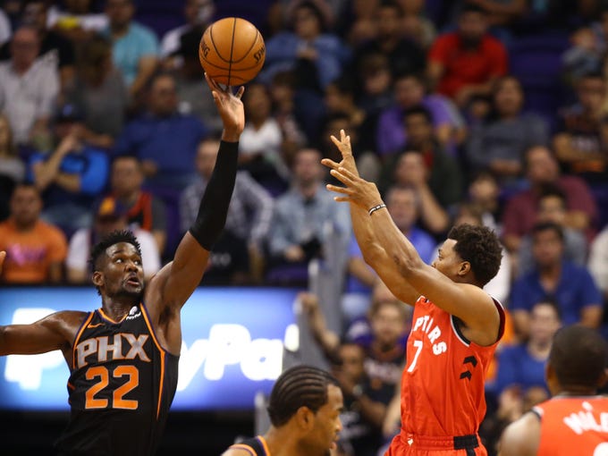 Nov 2, 2018; Phoenix, AZ, USA; Phoenix Suns center Deandre Ayton (22) blocks the shot of Toronto Raptors guard Kyle Lowry in the second half at Talking Stick Resort Arena. Mandatory Credit: Mark J. Rebilas-USA TODAY Sports