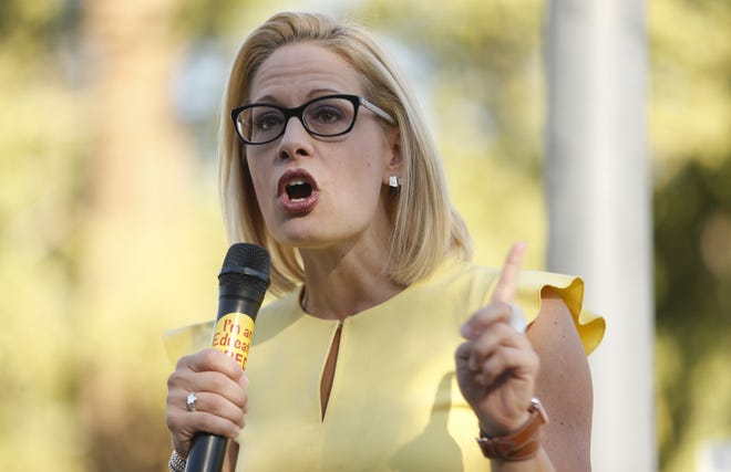 Senate candidate Kyrsten Sinema speaks during a rally outside the Arizona Education Association offices in Phoenix on November 3, 2018.