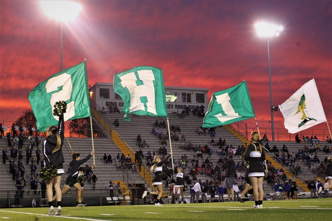 Lincoln's cheerleaders lead their football team onto the field. Godby defeated Lincoln 34-24 at Gene Cox Stadium on Friday, Nov. 2, 2018.