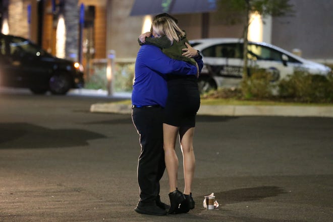 Melissa Hutchinson was working near by at in the same plaza where the shooting at Hot yoga at the intersecion of Thomasville Rd. and Bradford Rd. took place Friday, Nov. 2, 2018. Hutchinson is seen hugging friends after being so close to the action that had occurred just hours earlier.